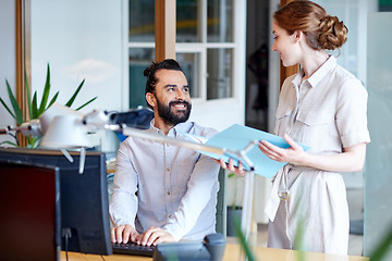 Image showing business team with computer and files in office