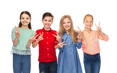 Image showing happy boy and girls showing peace hand sign