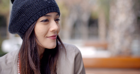 Image showing Cute smiling young woman in knitted hat