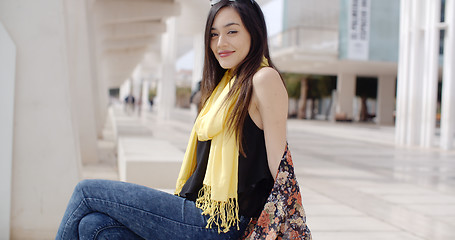 Image showing Attractive elegant young woman relaxing in town