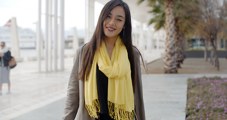 Image showing Stylish young woman enjoying a walk in town