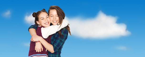 Image showing happy smiling pretty teenage girls hugging