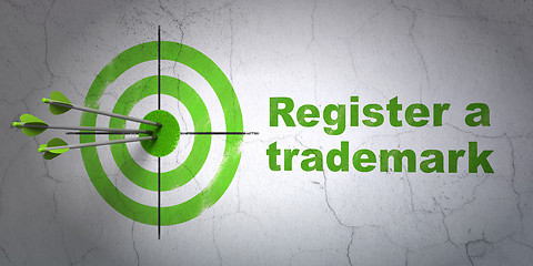 Image showing Law concept: target and Register A Trademark on wall background