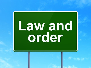 Image showing Law concept: Law And Order on road sign background