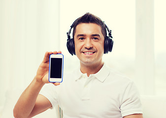 Image showing happy man with smartphone and headphones