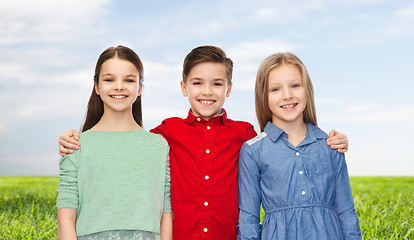 Image showing happy boy and girls hugging