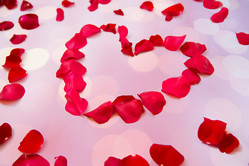 Image showing close up of red rose petals in heart shape