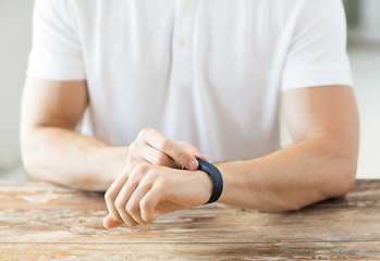 Image showing close up of man with heart-rate watch