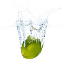 Image showing lime falling or dipping in water with splash