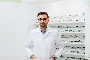 Image showing man optician in glasses and coat at optics store