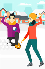 Image showing Couple playing in snowballs.