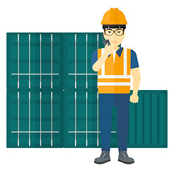 Image showing Stevedore standing on cargo containers background.