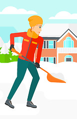 Image showing Woman shoveling and removing snow.