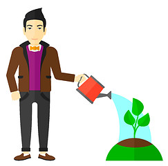 Image showing Man watering tree.