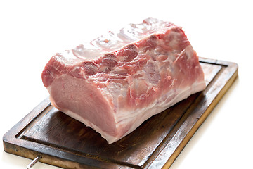 Image showing Cutting board with a pork loin.