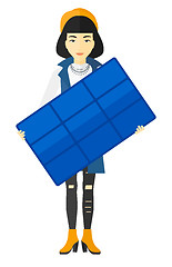 Image showing Woman holding solar panel.