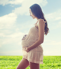 Image showing happy pregnant woman in chemise