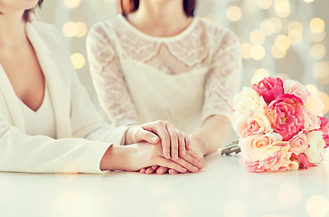 Image showing close up of happy lesbian couple with flowers