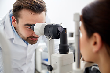 Image showing optician with tonometer and patient at eye clinic