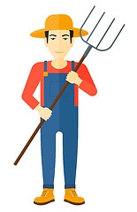 Image showing Farmer with pitchfork.