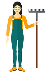 Image showing Farmer with rake.