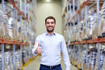 Image showing happy man at warehouse showing thumbs up gesture