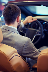 Image showing close up of man in cabriolet car at auto show