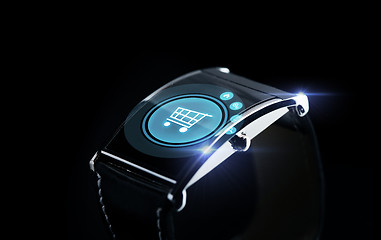 Image showing close up of smartwatch with shopping cart icon