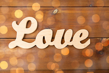 Image showing close up of word love cutout on wood