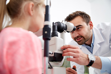 Image showing optician with tonometer and patient at eye clinic