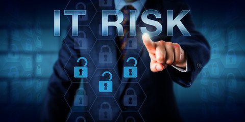 Image showing IT Manager Pressing IT RISK Onscreen