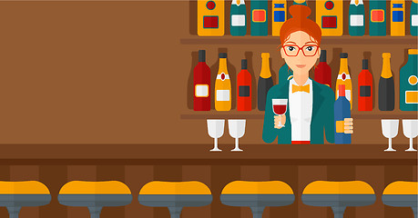 Image showing Bartender standing at the bar counter.