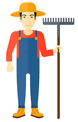 Image showing Farmer with rake.