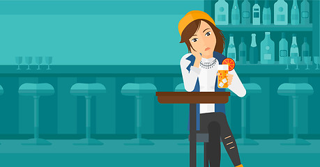 Image showing Woman sitting at bar.