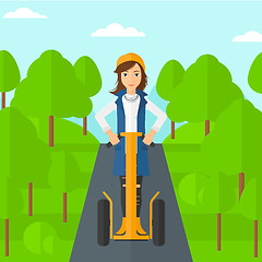 Image showing Woman riding on electric scooter.