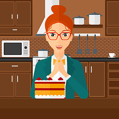 Image showing Woman looking at cake.