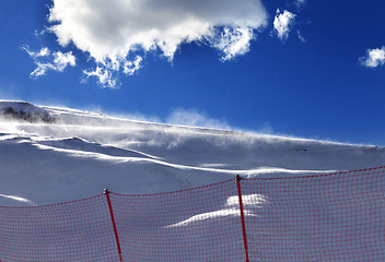 Image showing Off-piste slope during a blizzard and sunlight blue sky