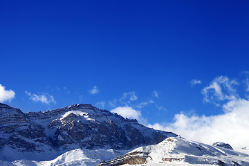 Image showing Snowy rocks at sun day