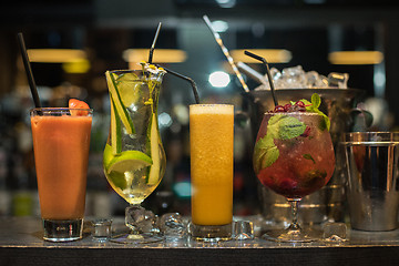 Image showing cocktails on bar background