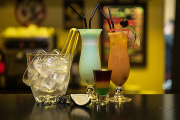 Image showing cocktails on bar background