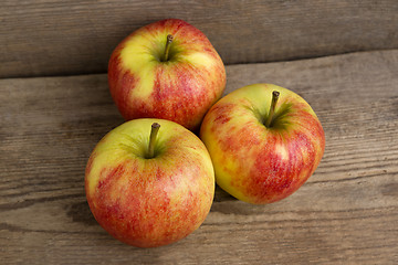 Image showing Red apples on wooden background