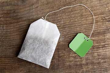 Image showing Teabag on wooden background   