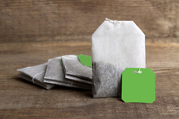 Image showing Teabags on wooden background   