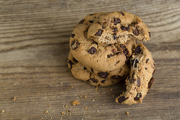 Image showing Brown cookies on wooden background