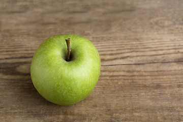 Image showing Green apple on wooden background