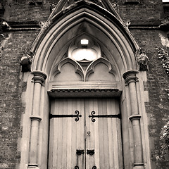 Image showing wooden parliament in london old church door and marble antique  