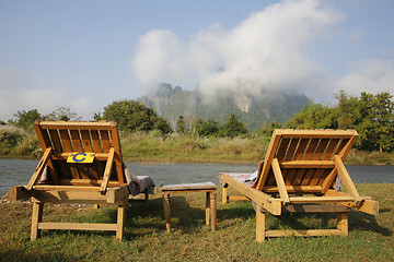 Image showing Two Seats in front of a Mountain