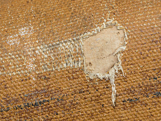 Image showing Detail (damage) of an old canvas suitcase, close-up