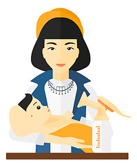 Image showing Woman with breast pump.