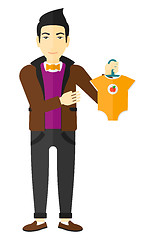 Image showing Man holding clothes for baby.